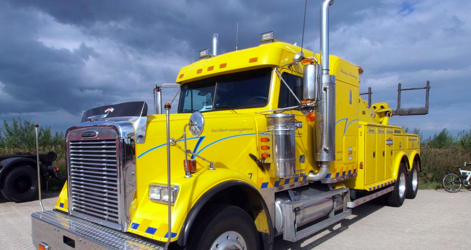 this picture shows tow truck deer field beach towing